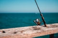 Fishing Pole Attached to Railing, Santa Monica Pier California Royalty Free Stock Photo