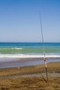 Fishing pole on a beach Royalty Free Stock Photo