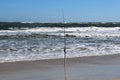 Fishing pole at the ocean beach background Royalty Free Stock Photo