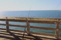 Fishing pole on the pier Royalty Free Stock Photo