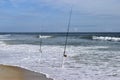 Fishing poles on beach Royalty Free Stock Photo