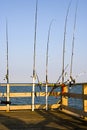 Fishing Poles on Ocean Pier Royalty Free Stock Photo