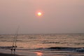 Fishing poles at sunrise