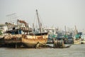 Fishing port with moored boats and some ruined on the coast of Phuket city Royalty Free Stock Photo