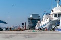 Fishing port pier with moored boats