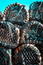 Fishing pots or traps stacked on a dock or quay Royalty Free Stock Photo