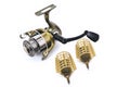 Fishing reel, fishing feeders white background close-up