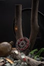 Fishing reel and iron baubles on a background of stones and wood