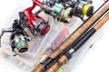 Fishing reels and rods on storage boxes Royalty Free Stock Photo