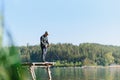 Fishing in river.A fisherman with a fishing rod on the river bank. Man fisherman catches a fish pike.Fishing, spinning reel, fish Royalty Free Stock Photo