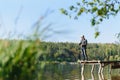 Fishing in river.A fisherman with a fishing rod on the river bank. Man fisherman catches a fish pike.Fishing, spinning reel, fish Royalty Free Stock Photo