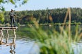 Fishing in river.A fisherman with a fishing rod on the river bank. Man fisherman catches a fish pike.Fishing, spinning reel, fish Royalty Free Stock Photo