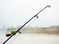 Fishing rod with bells to alert about the bite. Fishing rod in the fog on the river Royalty Free Stock Photo