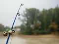 Fishing rod with bells to alert about the bite. Fishing rod in the fog on the river Royalty Free Stock Photo