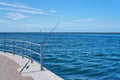 Fishing rod on the blue Baltic Sea in WarnemÃÂ¼nde Royalty Free Stock Photo