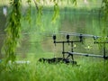 Fishing rod at the edge of a lake in Bucharest. Fishing on a beautiful day Royalty Free Stock Photo
