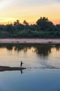 fishing rod lake fisherman men sport summer lure sunset water outdoor sunrise fish Royalty Free Stock Photo