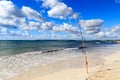 Fishing rod on Platja Es Trenc beach panorama and Mediterranean Sea on Majorca