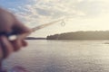 Fishing rod and reel hand holding. Shallow depth of field. Royalty Free Stock Photo