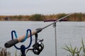 Fishing rod with a reel near the river. Fishing on carp, bream.