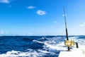Fishing rod in a saltwater boat during fishery day in blue ocean Royalty Free Stock Photo