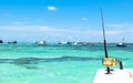 Fishing rod in a saltwater private motor boat during fishery day in blue ocean. Successful fishing concept. Royalty Free Stock Photo