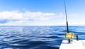 Fishing rod in a saltwater private motor boat during fishery day in blue ocean. Successful fishing concept. Royalty Free Stock Photo