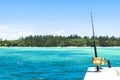 Fishing rod in a saltwater private motor boat during fishery day in blue ocean. Successful fishing concept. Royalty Free Stock Photo