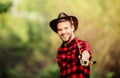 Fishing rod selective focus. happy fisherman in hat blurred. western portrait. Vintage style man. Wild West retro cowboy Royalty Free Stock Photo