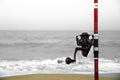 Fishing rod on the shore on a cloudy day Royalty Free Stock Photo