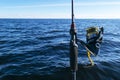 Fishing on the lake. Hands of fisherman with fishing rod. Macro shot. Fishing rod and hands of fisherman over lake water. Spinning Royalty Free Stock Photo