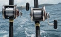 Fishing rods on a boat over blue sea and sky