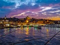 Fishing rods on the Galata Bridge over the Golden Horn in Istanbul at dusk Royalty Free Stock Photo