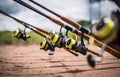 Fishing rods are lined up by the lake to wait for fish to eat bait Royalty Free Stock Photo