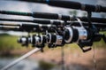 Fishing rods are lined up by the lake to wait for fish to eat bait Royalty Free Stock Photo