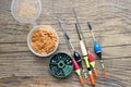 Fishing rods and reels with fishing line on an old wooden background with free space.