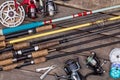 Fishing rods and reels on wooden boards