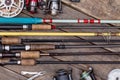 Fishing rods and reels on wooden boards Royalty Free Stock Photo