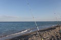 Fishing rods on sea beach, seashore landscape. Royalty Free Stock Photo