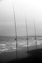 Fishing rods on the shore on a cloudy day Royalty Free Stock Photo