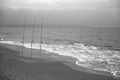 Fishing rods on the shore on a cloudy day Royalty Free Stock Photo