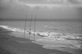 Fishing rods on the shore on a cloudy day Royalty Free Stock Photo