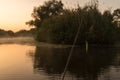 Fishing rural landscape. Fishing rod with vobler early morning. Horizontal photo. Royalty Free Stock Photo