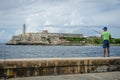 Fishing at the seawall in Havana, Cuba Royalty Free Stock Photo