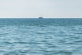 Fishing ship at sea. Lonely boat trawler goes to port for sell fish catch. Calm clear sunny weather. Beautiful horizon of seascape Royalty Free Stock Photo