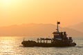 Fishing ship on the water in the sunset. Hong Kong, Asia Royalty Free Stock Photo