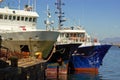 Fishing ships at pier in ocean Royalty Free Stock Photo