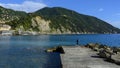 Fishing from the shoreline of the Ligurian Sea at the edge of Camogli, Italy.