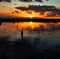 Fishing at sunset Royalty Free Stock Photo