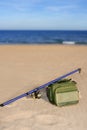 Fishing surfcasting rod and box over beach sand